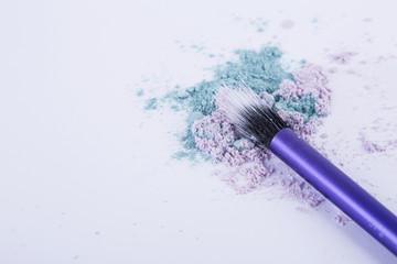 makeup duofiber brush and loose eyeshadow isolated