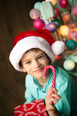 Merry Christmas and Happy Holiday! Cute little child boy with ma
