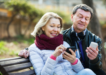 Couple with mobile phones