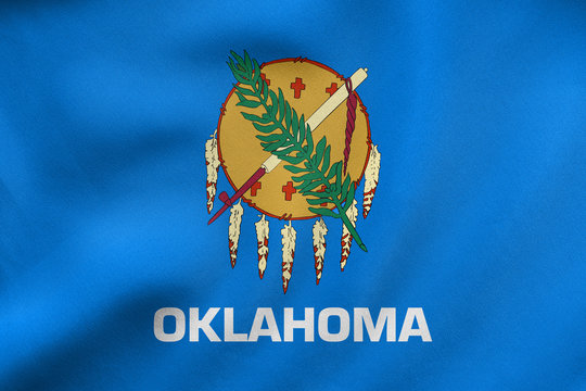 Flag of Oklahoma waving, real fabric texture