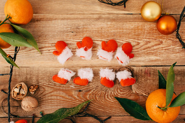 Christmas composition with a garland and tangerines