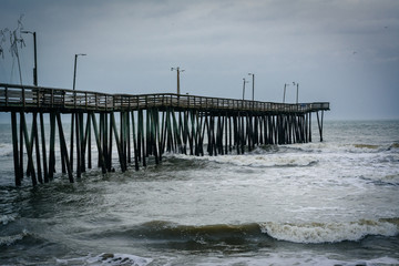 Waves in the Atlantic Ocean and the Fishing Pier in Virginia Bea