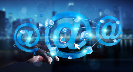 Businessman touching 3D rendering email icon with his finger