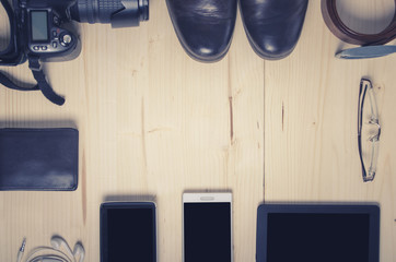 Overhead of essentials modern man on wooden background 