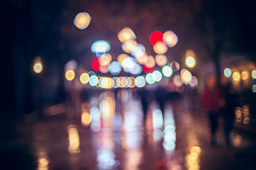 Pedestrianized street in Tirana decorated with colorful lights for New Year and Christmas holidays,...
