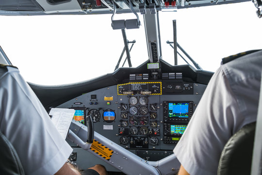 Interior details of a water plane with pilot and co pilot on board while flying. 