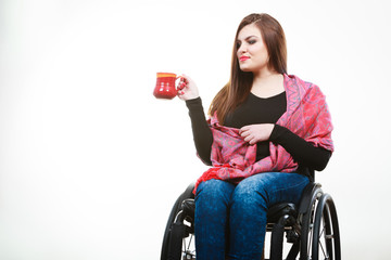 Cheerful crippled lady on wheelchair.
