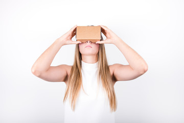 young female model looking up through virtual reality headset fr