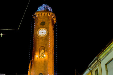 Christmas lights on ancient clock tower