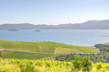 Islands in the Adriatic Sea can be seen off the Dalmatian Coast in Croatia, with green verdant...
