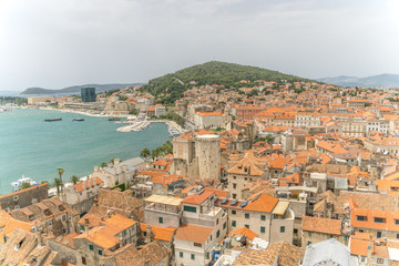 Fototapeta na wymiar A high angle view of the Croatian town of Split, from the medieval St Dominus' Bell Tower, with a view of the port of Split and the Diocletian's Palace.