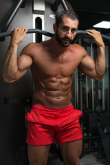 Naklejka na ściany i meble Muscular Man Doing Heavy Weight Exercise For Back