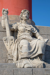 Obraz premium Allegorical sculpture of the Volga river(1809-1813) at the bottom of the southern Rostral column close up. St. Petersburg, Russia