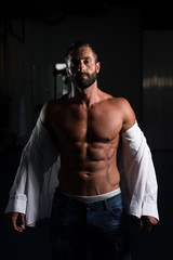 Fototapeta na wymiar Sexy Italian Man Posing In White Shirt