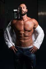 Fototapeta na wymiar Sexy Latin Man Posing In White Shirt