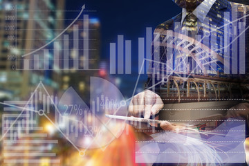 Double exposure businessman hand using digital tablet with virtu