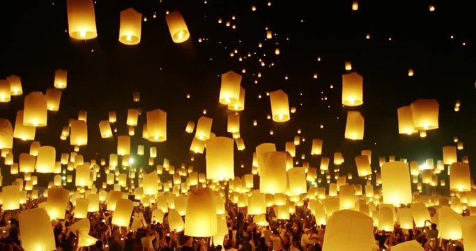 Lanterns floating in night sky at Yi Peng Festival. Chiangmai, Thailand. 4k