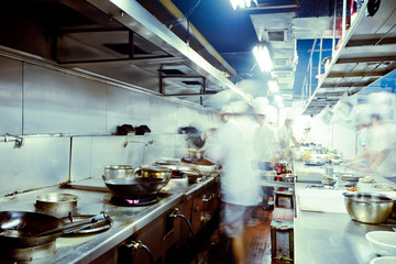 motion chefs of a restaurant kitchen