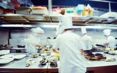 motion chefs of a restaurant kitchen