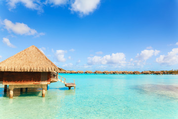 Over water bungalows with steps into amazing green lagoon