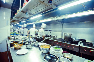 motion chefs of a restaurant kitchen
