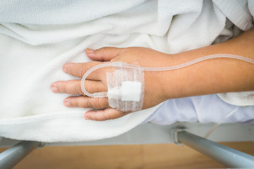 Obraz na płótnie Canvas Close-up woman patient in hospital with saline intravenous (IV).
