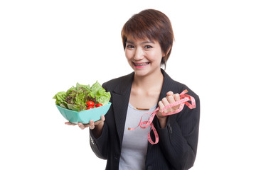 Healthy  Asian business woman with measuring tape and salad.