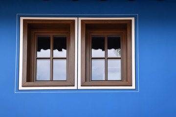 Windows on a blue facade