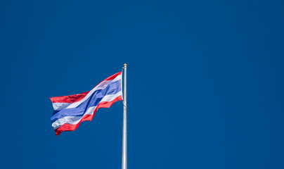 thai flag with blue sky background.