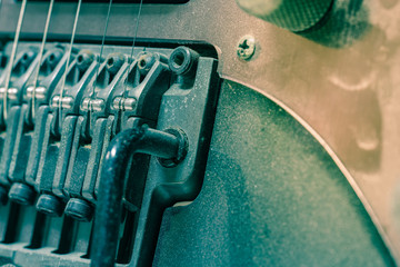 Detail of electric guitar pickups with dust, Close up shot of dirty Electric guitar tremolo -...