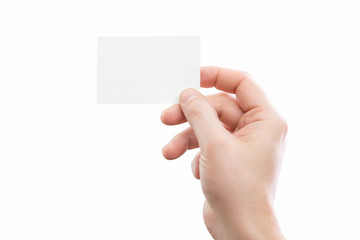 Obraz premium Male hand holding white business card at isolated background 