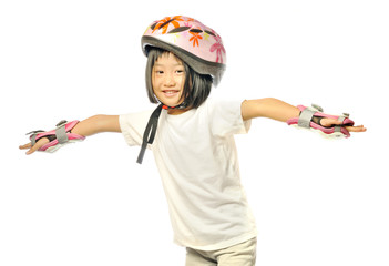 Asian little girl is playing roller blades