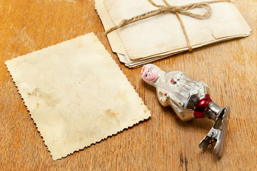 Old photographs and Christmas toy on the table. Nostalgia