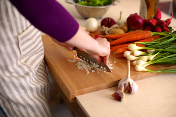 Young Woman Cooking in the kitchen. Healthy Food