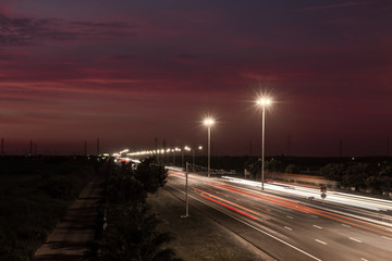 Speed Traffic at light trails on motorway highway at night,backg