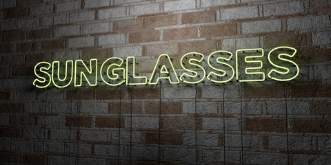 SUNGLASSES - Glowing Neon Sign on stonework wall - 3D rendered royalty free stock illustration.  Can be used for online banner ads and direct mailers..
