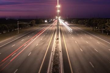 Obraz premium Speed Traffic at light trails on motorway highway at night,backg