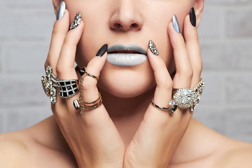 woman's hands with jewelry rings.close-up beauty and fashion girl, make-up and manicure