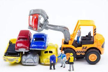 Miniature tiny toys doing business about cemetery car was damage