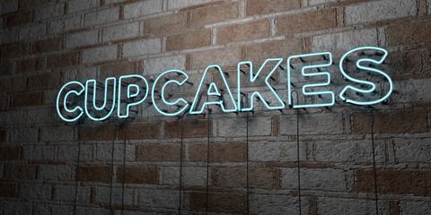 CUPCAKES - Glowing Neon Sign on stonework wall - 3D rendered royalty free stock illustration.  Can be used for online banner ads and direct mailers..