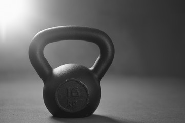 Naklejka na ściany i meble Close up of kettlebell weights on floor gym. Fitness and a healt