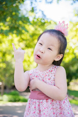 Little asian girl thinking in park