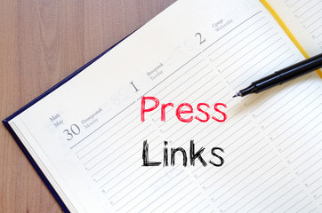 Press links concept on notebook