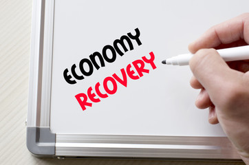 Economy recovery written on whiteboard