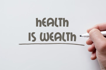 Health is wealth written on whiteboard