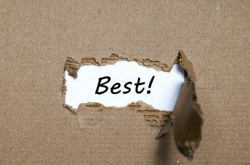 The word best appearing behind torn paper