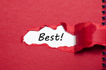 The word best appearing behind torn paper