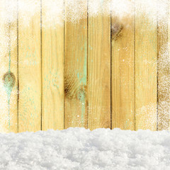 Christmas pine wooden background with snowfall and snowdrift. View with copy space