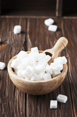 White sugar on the wooden table