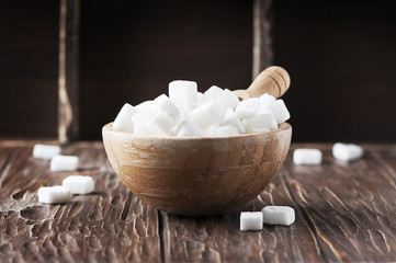 White sugar on the wooden table
